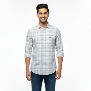 Man wearing a light grey checked casual full sleeve shirt with blue denim jeans